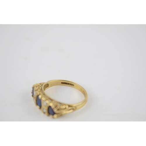 259 - 9ct gold ring set with 4 diamonds and 3 larger sapphires, 3.6 grams, size P.