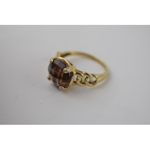 266 - 9ct gold ring with ornate shoulders set with smoky quartz and illusion set diamonds, 4.4 grams, size... 