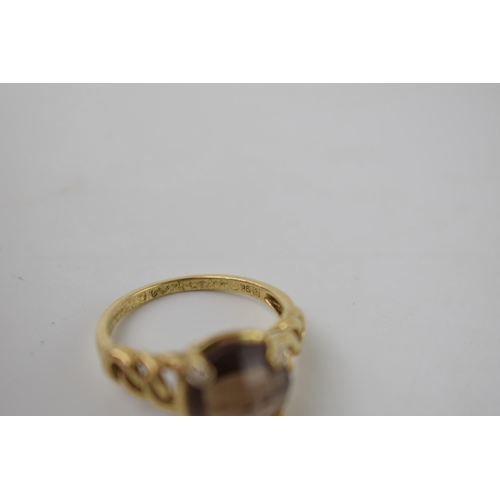 266 - 9ct gold ring with ornate shoulders set with smoky quartz and illusion set diamonds, 4.4 grams, size... 