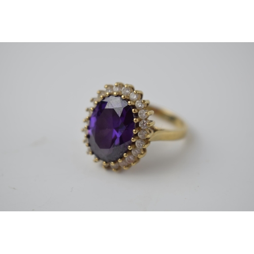 267 - 9ct gold ring set with CZs and a large amethyst style stone, 9.7 grams, size Q.