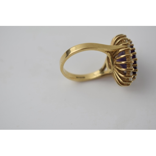 267 - 9ct gold ring set with CZs and a large amethyst style stone, 9.7 grams, size Q.