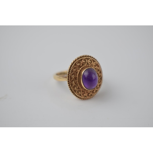 269 - 9ct gold ladies ring with ornate setting with polished cabachon stone, 5.9 grams, size M.