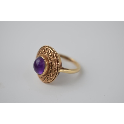 269 - 9ct gold ladies ring with ornate setting with polished cabachon stone, 5.9 grams, size M.