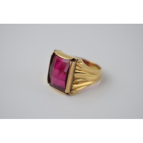 270 - 18ct gold with fluted shoulders with large red stone face, 14.0 grams, size U.