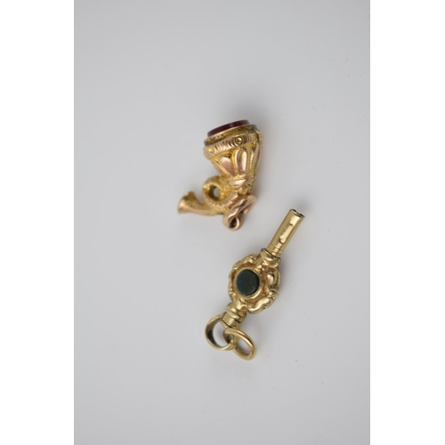 285 - 19th century gold and hardstone watch key combined weight 3.66g, together with un-hallmarked hardsto... 