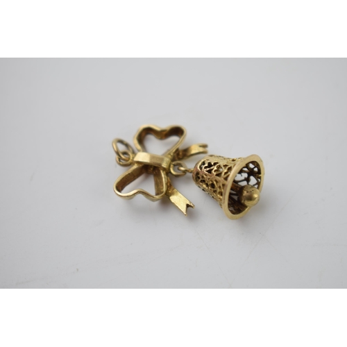 290 - 9ct gold charm in the form a bell hanging from a ribbon, 4.3 grams.