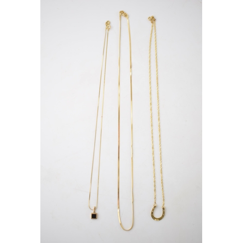 296 - A trio of 9ct gold necklaces, 2 with pendants, one in the form of a horseshoe, combined weight 5.1 g... 