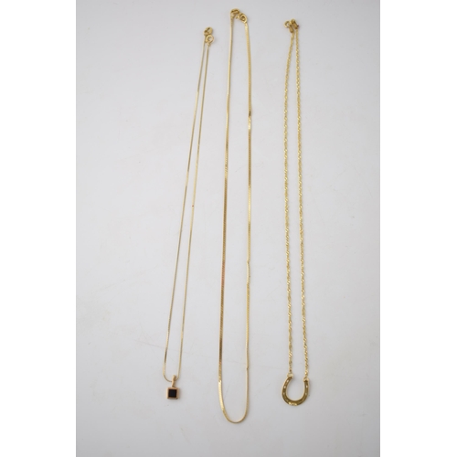 296 - A trio of 9ct gold necklaces, 2 with pendants, one in the form of a horseshoe, combined weight 5.1 g... 