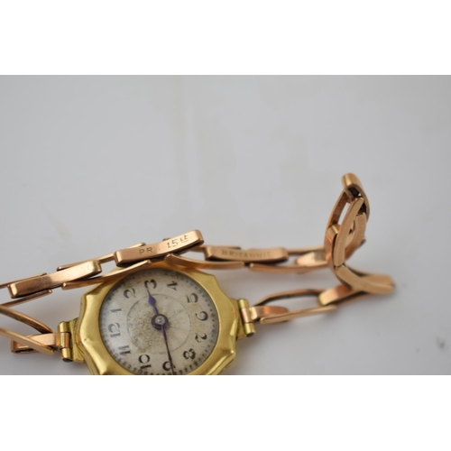 299 - 18ct gold ladies wristwatch with engraved case, on 15ct rose gold strap, gross weight 14.7 grams.