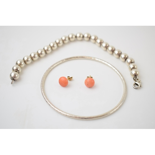 306 - Jewellery to include a pair of coral ear studs, a silver bangle and a silver bead bracelet, 22.2 gra... 