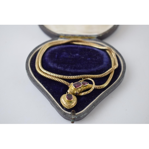 320 - Victorian gold snake mourning necklace, set with garnets, 22.6 grams, in fitted case.