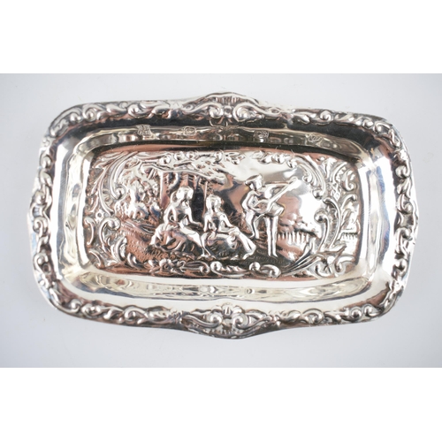 54 - Hallmarked silver heavily embossed pin tray with a romantical scene of a gentleman playing music for... 