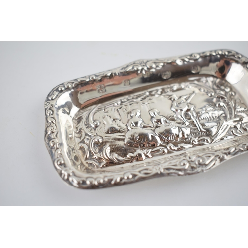 54 - Hallmarked silver heavily embossed pin tray with a romantical scene of a gentleman playing music for... 