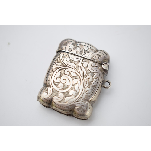 64 - Hallmarked silver vesta case with engraved decoration, 18.1 grams, Birmingham 1905.