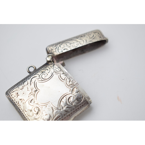 66 - Hallmarked silver vesta case with engraved decoration, 18.8 grams, Birmingham 1907.