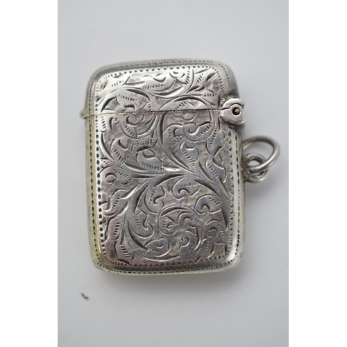 67 - Hallmarked silver vesta case with engraved decoration, 15.8 grams, Birmingham.