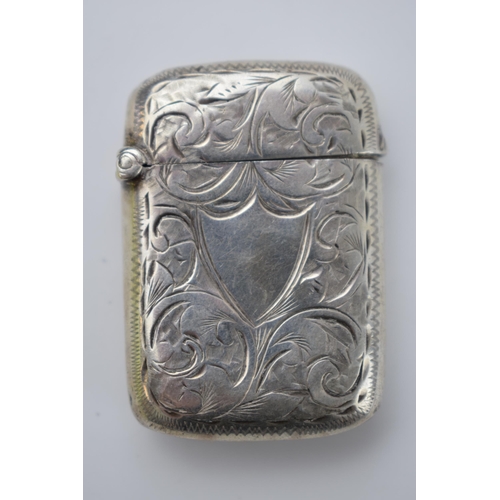 70 - Hallmarked silver vesta case with engraved decoration, 16.2 grams, Birmingham 1897.