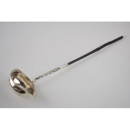 74 - Antique silver punch ladle with ebonised wooden handle, hallmarks rubbed, believed Georgian, 37cm lo... 