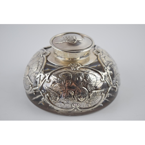 75 - A late Victorian silver mounted glass inkwell, with Reynold's Angels design, William Comyns, London ... 