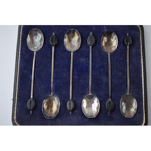 76 - Cased set of silver coffee spoons with coffee bean finials, 28.4 grams, Birmingham 1926.