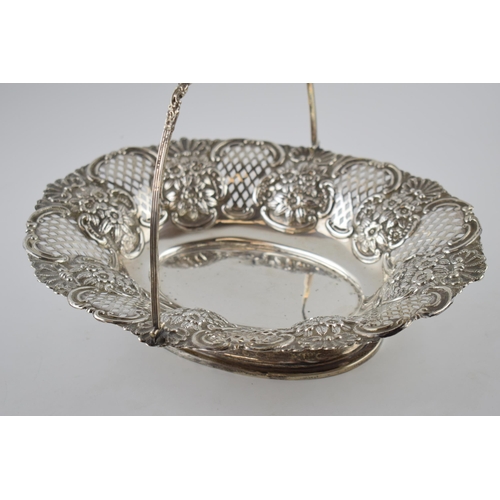 80 - Hallmarked silver large basket with swingover handle and pierced decoration, with foliage decoration... 