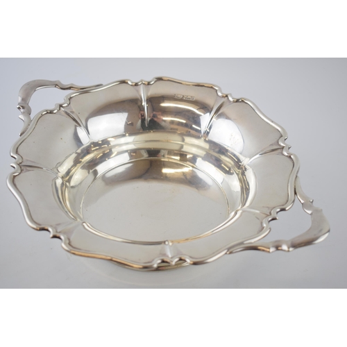 84 - Hallmarked silver table centrepiece / two handled bowl, with shaped edge, 769.2 grams / 24.73 oz, 35... 