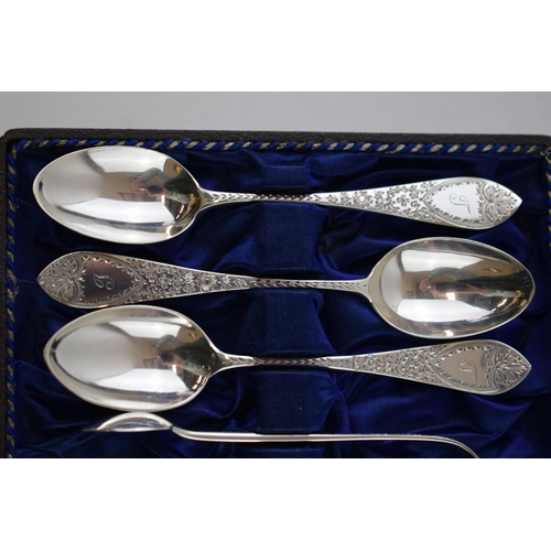 86 - Hallmarked silver set to include 6 spoons and a pair of tongs, 75.0 grams, with bright cut decoratio... 