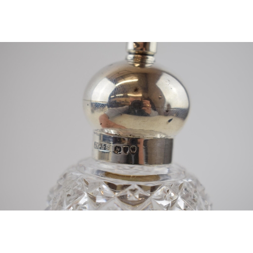 98 - Silver rose water perfume bottle, J Grinsell & Sons, London 1895, 17cm tall.