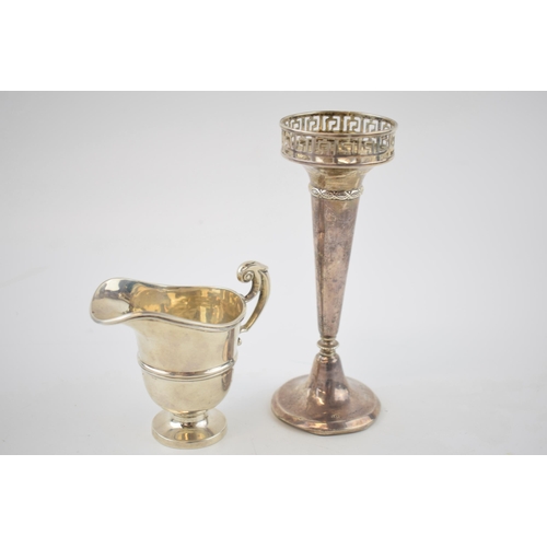 138 - Silver cream jug, Chester 1912, 48.4 grams, with a loaded silver vase with gallery top, Birmingham 1... 