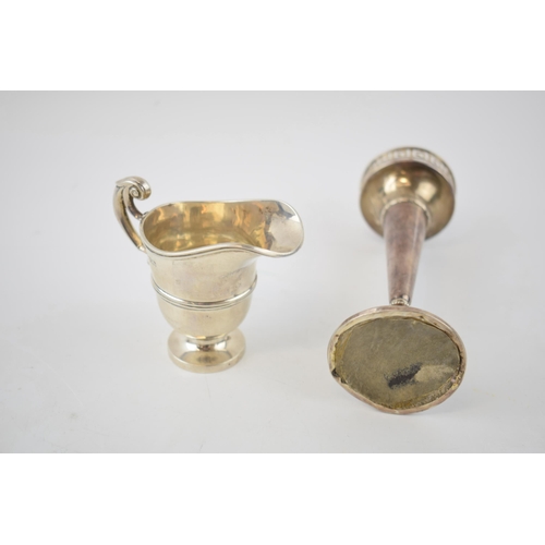 138 - Silver cream jug, Chester 1912, 48.4 grams, with a loaded silver vase with gallery top, Birmingham 1... 