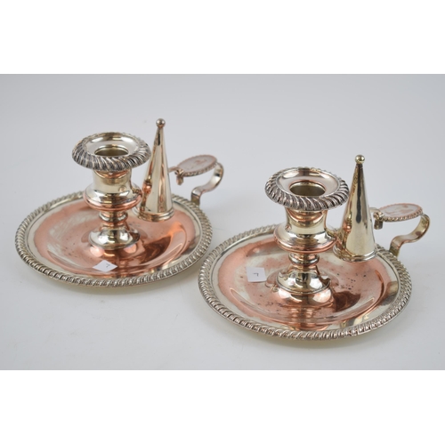 141 - A pair of Victorian Sheffield plate on copper chambersticks (2), 17cm diameter.