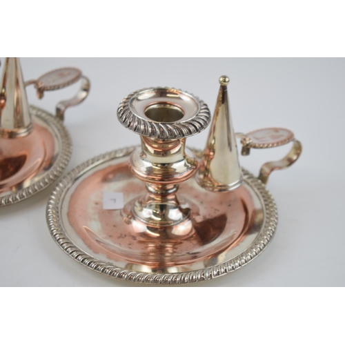 141 - A pair of Victorian Sheffield plate on copper chambersticks (2), 17cm diameter.