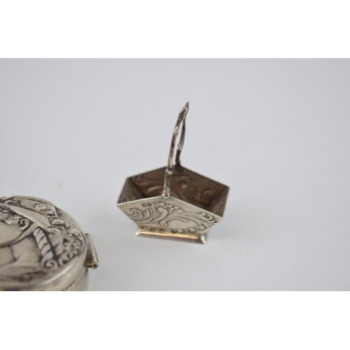 154 - Silver circular pill box depicting a girl in bonnet with a silver miniature log bucket with raised h... 