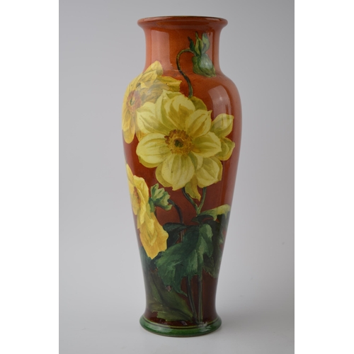 158 - Doulton Lambeth Faience high-shouldered vase decorated with Daffodils on red / deep orange backgroun... 