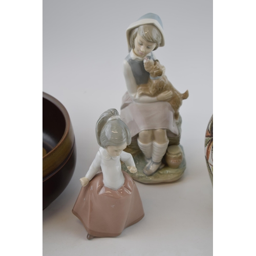 102 - Pottery to include a Lladro figure of a girl with a dog, a Nao girl together with 2 pieces of Denby ... 