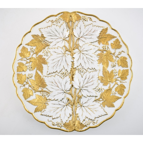 127 - Early 20th century Meissen embossed cabinet plate with gilt leaves and vines, 26cm diameter, incised... 