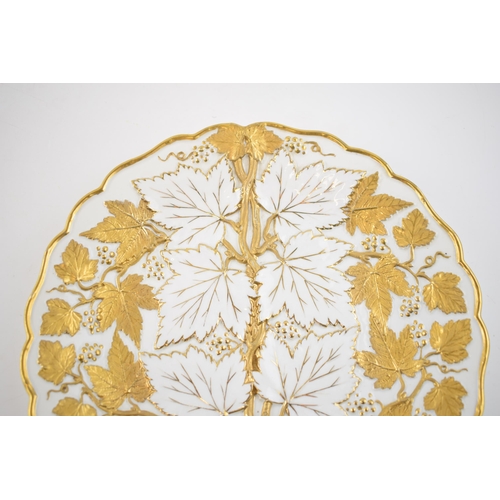 127 - Early 20th century Meissen embossed cabinet plate with gilt leaves and vines, 26cm diameter, incised... 