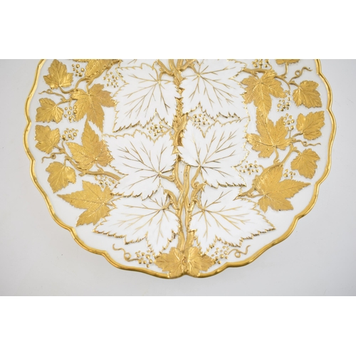 127 - Early 20th century Meissen embossed cabinet plate with gilt leaves and vines, 26cm diameter, incised... 