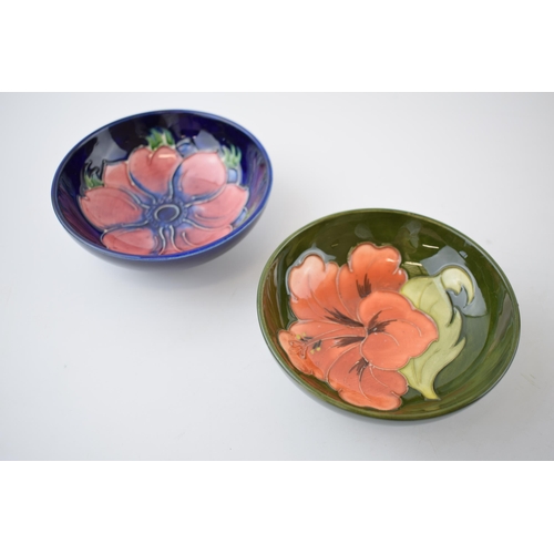 146 - A pair of Moorcroft shallow bowls in the Hibiscus and Clematis pattern (2), 12cm diameter.