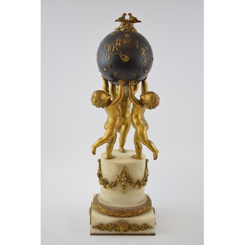 Louis XVI style gilt bronze & white marble spehere clock, late 19th century, the Roman numerals and arrow-form hands applied to a black-painted sphere adorned with stars held up by 3 cherubs, with key, Le Roy et Fils, 57 New Bond Street, Made in France, 45cm tall.
