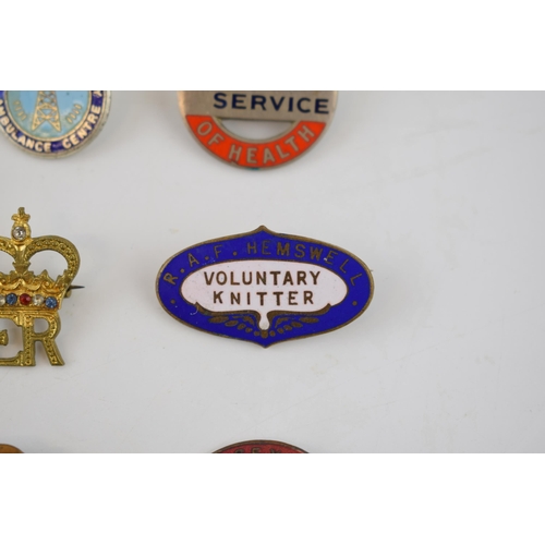 483 - A good collection of vintage enamel badges of nursing interest, Women's Institute, Air Raid Welfare,... 