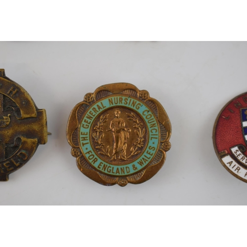 483 - A good collection of vintage enamel badges of nursing interest, Women's Institute, Air Raid Welfare,... 