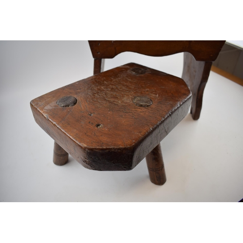 500 - A three legged milking stool (height 18cm, width 28cm) together with another country stool (Height 2... 