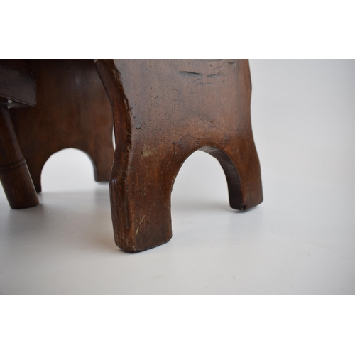 500 - A three legged milking stool (height 18cm, width 28cm) together with another country stool (Height 2... 