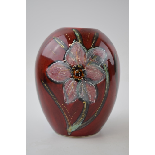 75 - Anita Harris Art Pottery trial vase, decorated with daffodils, 16cm tall, signed by Anita.