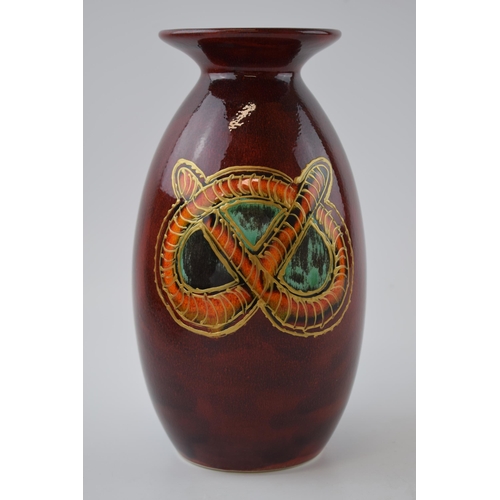 77 - Anita Harris Art Pottery vase, decorated with a Stafford Knot, 21cm tall, signed by Anita.