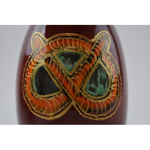 77 - Anita Harris Art Pottery vase, decorated with a Stafford Knot, 21cm tall, signed by Anita.