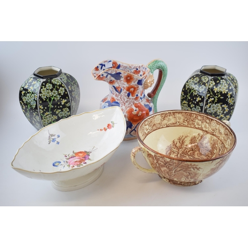 131B - Pottery to include a 19th century English pottery floral comport with a pair of Royal Doulton series... 