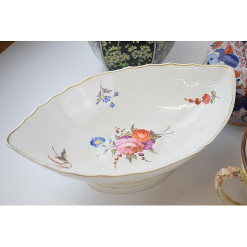 131B - Pottery to include a 19th century English pottery floral comport with a pair of Royal Doulton series... 