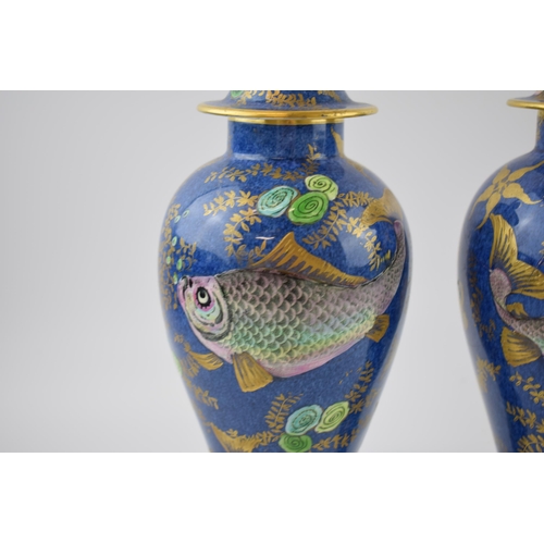 132 - A pair of New Chelsea Staffs lidded urns with fish decor and gilded decoration, 26cm tall (2 - 1 af)... 